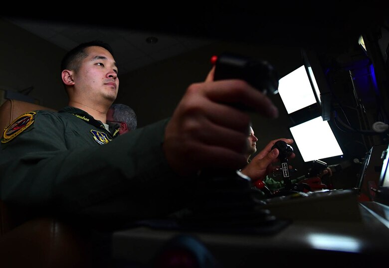 Master Sgt. Johann, 926th Wing, tracks a simulated
enemy during a training mission July 7, 2017. As a sensor operator, Johann operates the multi-spectral targeting system of an MQ-9 for reconnaissance and providing terminal guidance for weapons. Johann was selected as one of the Air Force's 12 Outstanding Airmen of the Year. (U.S. Air Force photo/Senior Airman Christian Clausen)
