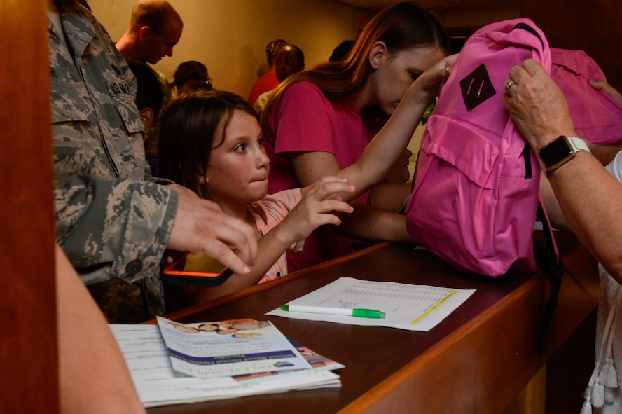 Free backpacks filled with school supplies were presented to military families at the Back to School Night hosted by the 2nd Force Support Squadron at Barksdale Air Force Base, La., July 24, 2017. The school supplies and bags were donated by agencies from around the local community. (U.S. Air Force Photo/Airman 1st Class Sydney Bennett)