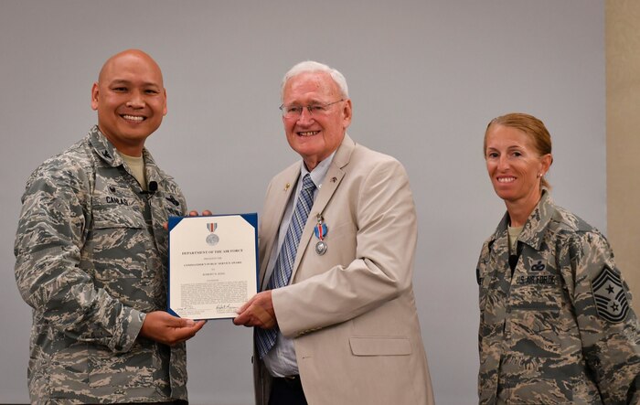 Col. Jimmy Canlas, 437th Airlift Wing commander, left, and Command Chief Master Sgt. Jennifer Kersey, 437th AW command chief, right, present Councilman Bob King, City of North Charleston, the Commander’s Public Service Award during a ceremony at Joint Base Charleston, S.C., July 27, 2017. King received the award in recognition of his enduring contributions supporting service members and families serving at JB Charleston that have contributed significantly to the accomplishment of the Air Force’s mission.