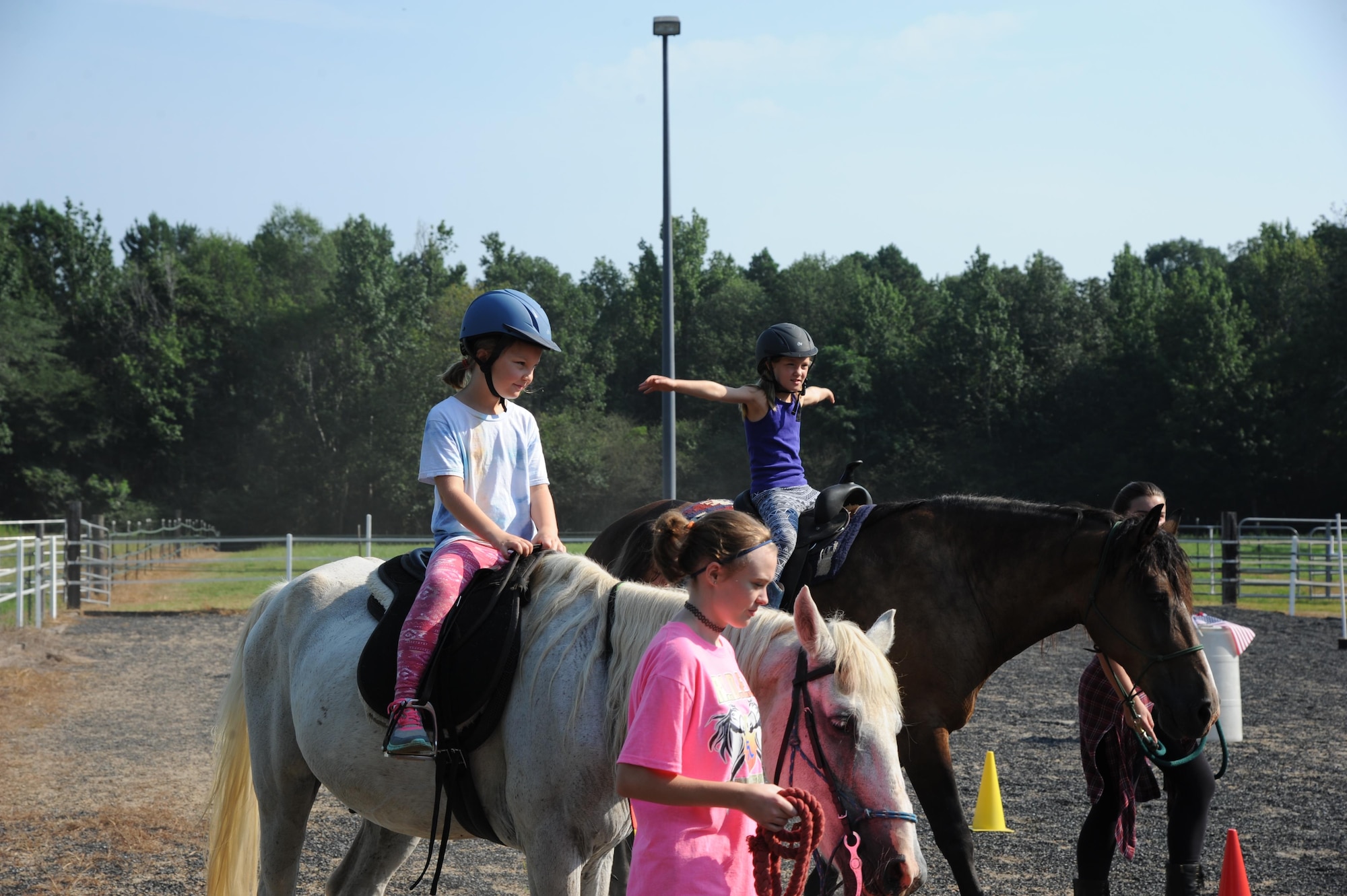 Members of the Exceptional Family Member Program from Columbus Air Force Base, Mississippi, ride horses July 21, 2017, in Caledonia, Mississippi, as part of a Riding to Improve Development, Esteem, Strength and Spirit Program function. Volunteers ensured riders were safe and enjoyed themselves. (U.S. Air Force photo by Airman 1st Class Beaux Hebert)