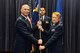 Col. Michael Manion, 55th Wing commander, passes the 55th Medical Group guidon to , Col. Judy Stoltmann as she assumes command July 28 at Offutt Air Force Base, Nebraska (U.S. Air Force photo by Charles Haymond)