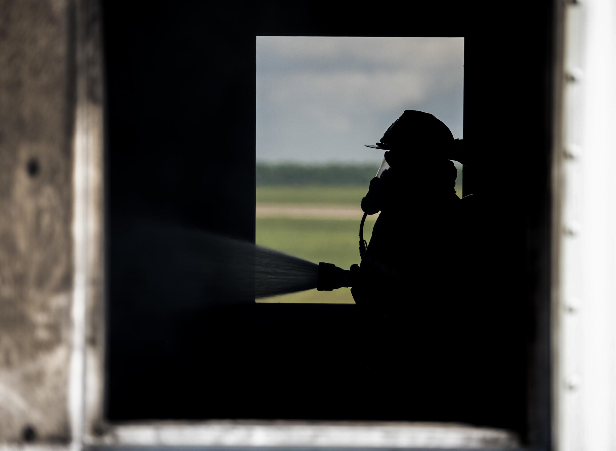 A U.S. Air Force firefighter assigned to the 6th Civil Engineer Squadron extinguishes a fire during a structural, live-burn exercise at MacDill Air Force Base, Fla., July 24, 2017. The exercise was conducted to show the behavior of a live fire inside a structure, and how to safely operate their equipment while in a burning building. (U.S. Air Force photo by Airman 1st Class Adam R. Shanks)
SrA Adams
