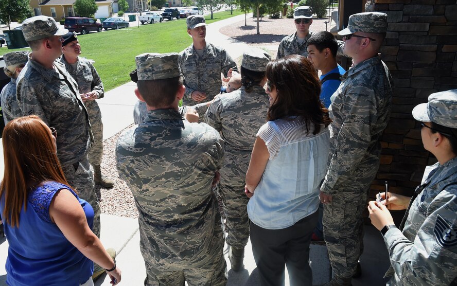 Chaplain (Capt.) Portmann Werner, 50th Space Wing chaplain, asks 50th Mission Support Group resiliency picnic attendees questions at Schriever Air Force Base, Colorado, Wednesday, July 26, 2017. The picnic was held to build Airmen’s resiliency and establish connections with Chaplain staff. (U.S. Air Force photo/Senior Airman Arielle Vasquez)