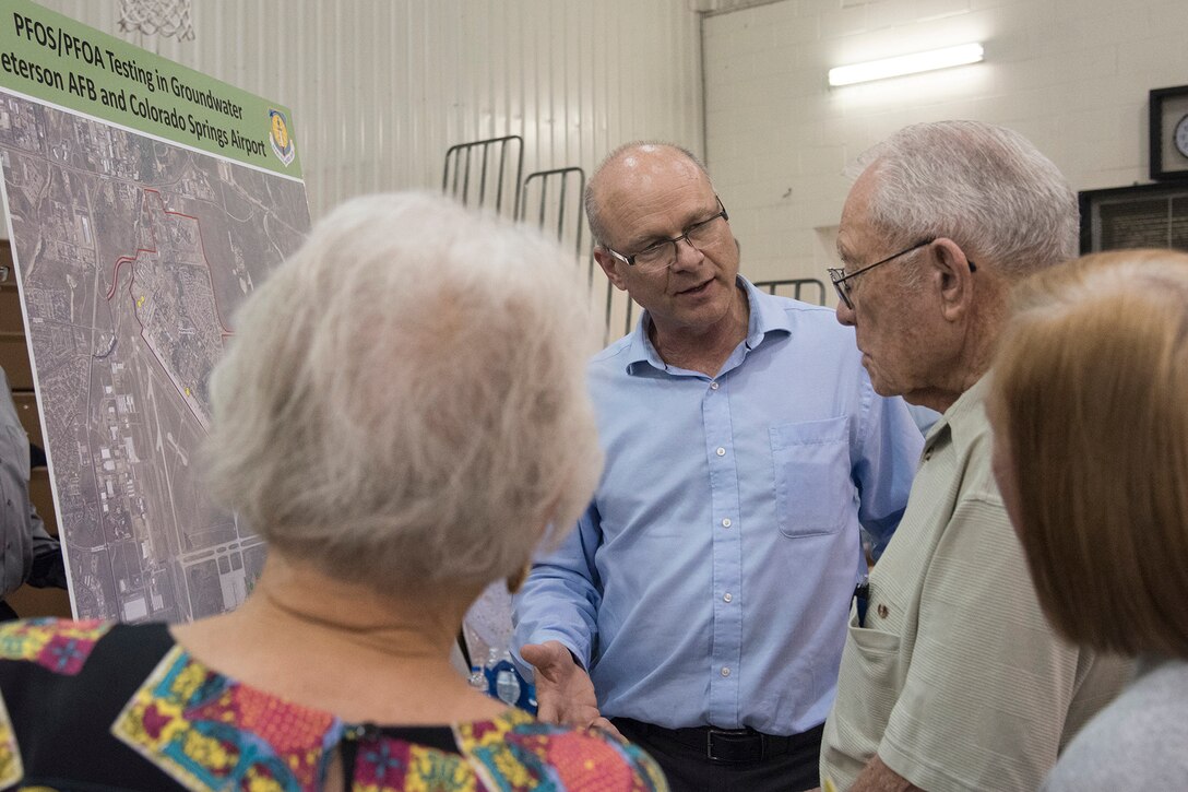 FOUNTAIN, Colo. – Dr. W. Brian Howard, Air Force Civil Engineer Center toxicology, answers Colorado Springs community members’ questions during an open house at Janitell Junior High School, July 25, 2017, Fountain, Colo. The open house allowed for community members to personally ask questions to local state, federal and military members on the site inspection report released earlier that day on the perfluorooctane sulfonate and perfluorooctanoic acid contamination. (U.S. Air Force photo by Staff Sgt. Tiffany Lundberg)