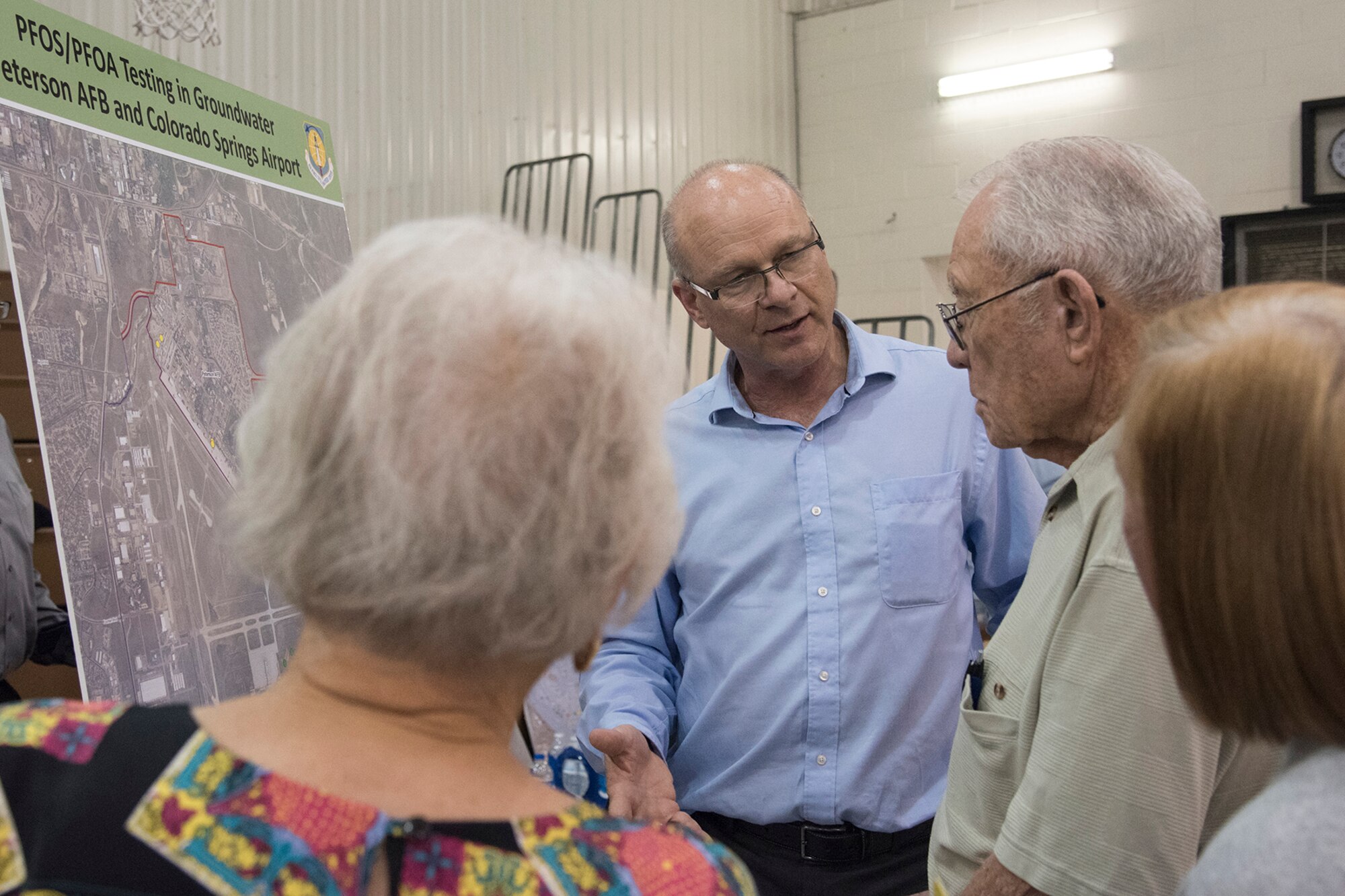 FOUNTAIN, Colo. – Dr. W. Brian Howard, Air Force Civil Engineer Center toxicology, answers Colorado Springs community members’ questions during an open house at Janitell Junior High School, July 25, 2017, Fountain, Colo. The open house allowed for community members to personally ask questions to local state, federal and military members on the site inspection report released earlier that day on the perfluorooctane sulfonate and perfluorooctanoic acid contamination. (U.S. Air Force photo by Staff Sgt. Tiffany Lundberg)