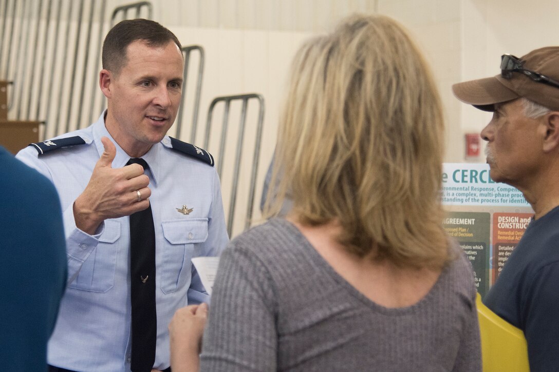 FOUNTAIN, Colo. - Col. Todd Moore, 21st Space Wing commander, answers Colorado Springs community members’ questions during an open house at Janitell Junior High School, July 25, 2017, Fountain, Colo. The open house was one of several AFCEC and 21st SW community engagements discussing the site inspection report released earlier that day covering an update on the perfluorooctane sulfonate and perfluorooctanoic acid contamination. They also met with key state and federal members during a closed-door meeting followed with a media roundtable and the open house. (U.S. Air Force photo by Staff Sgt. Tiffany Lundberg)