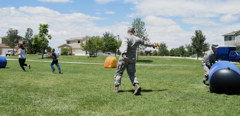 50th Mission Support Group resiliency picnic attendees play a round of laser tag at Schriever Air Force Base, Colorado, Wednesday, July 26, 2017. Picnic activities included laser tag competitions, board games and corn hole. (U.S. Air Force photo/Senior Airman Arielle Vasquez)