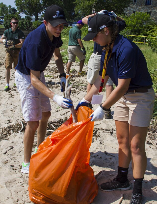 Chris Escamilla picks up trash with other high school students as part of a community service project at a beach during the 2017 Summer Leadership and Character Development Academy (SLCDA) aboard Quantico, Va., July 21. The SLCDA is a six-day-long program focused on teaching high school students skills critical to future success, such as honor, courage and commitment. Escamilla travelled approximately 7,000 miles overseas from Naval Air Facility, Atsugi, Japan, to Quantico to attend the event, and is a student at Zama American High School.