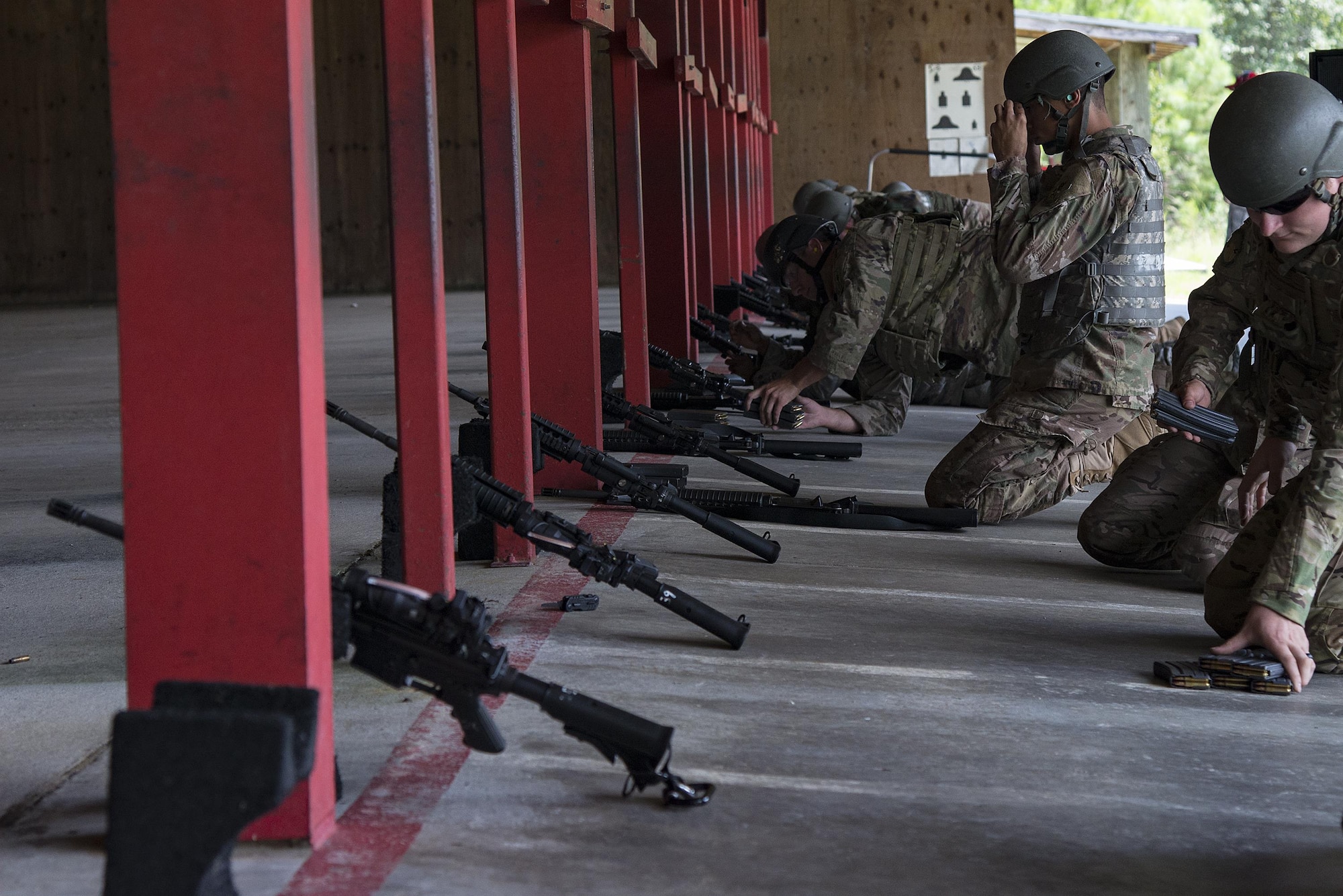 Airmen prepare to shoot at the Combat Arms Training and Maintenance range, July 25, 2017, at Moody Air Force Base, Ga. During CATM, Airmen must demonstrate quality safety standards while handling and shooting their weapons in order to qualify to deploy. (U.S. Air Force photo by Airman 1st Class Erick Requadt)
