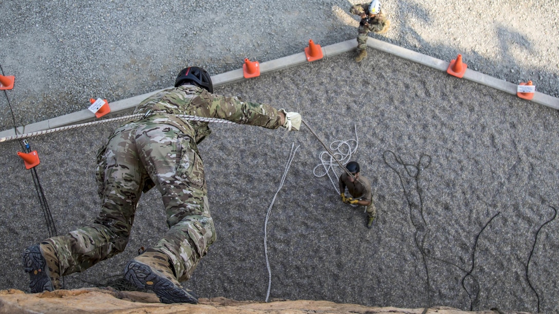 A soldier descends on a wall using the Australian rappel technique during a demonstration at the Summit Bechtel Reserve near Glen Jean, W.V., July 21, 2017. The soldier is assigned to the 5th Special Forces Group. Army photo by Staff Sgt. Matt Britton