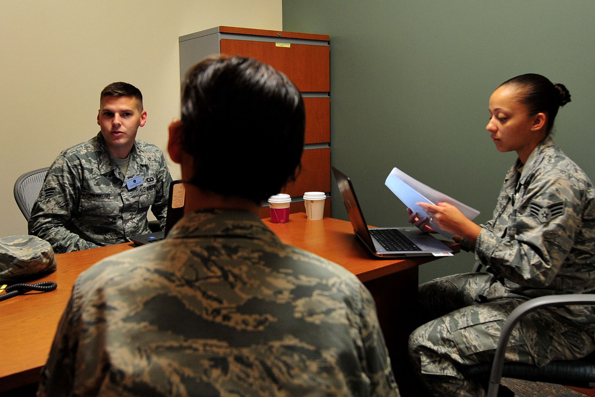 U.S. Air Force Senior Airman Kevin Hammond, left, and Senior Airman Therysa King, right, Air Force Chief of Staff Revitalizing Air Force Squadrons team members, brief a survey participant at Shaw Air Force Base, S.C., July 25, 2017. Team members held peer-to-peer interviews and focus groups to receive feedback from Shaw Airmen regarding CSAF Gen. David L. Goldfein’s primary focus of revitalizing squadrons as the Air Force’s core fighting unit. (U.S. Air Force photo by Airman 1st Class Kathryn R.C. Reaves)