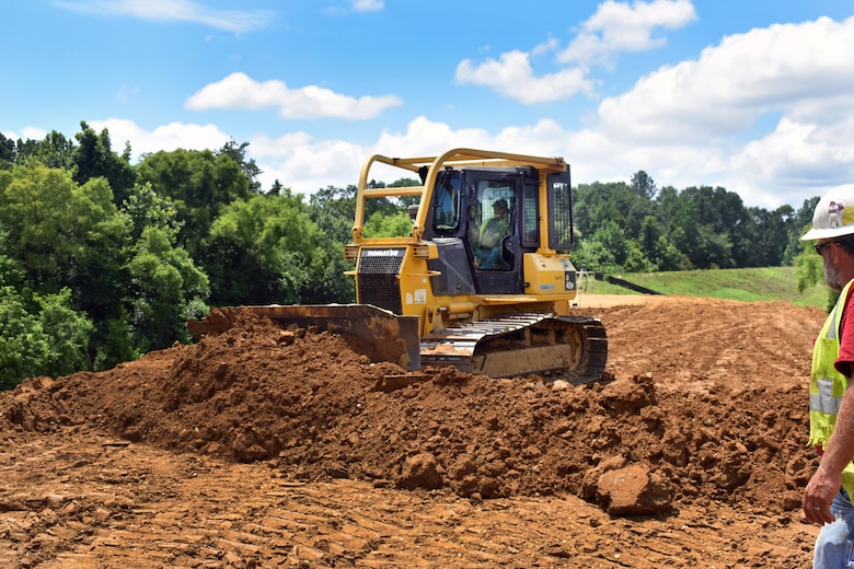A bulldozer driver places dirt for the levee in preparation for compacting. Total cost for the design and construction of the relocated levee is an estimated $1.7 million, which includes the locally funded, non-federal share of 35 percent.