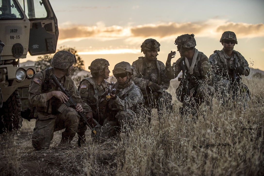 Soldiers conduct reconnaissance the night before a morning mission at Fort Hunter Liggett, Calif., July 22, 2017, as part of a combat support training exercise. The soldiers are military police reservists. Army Reserve photo by Master Sgt. Michel Sauret