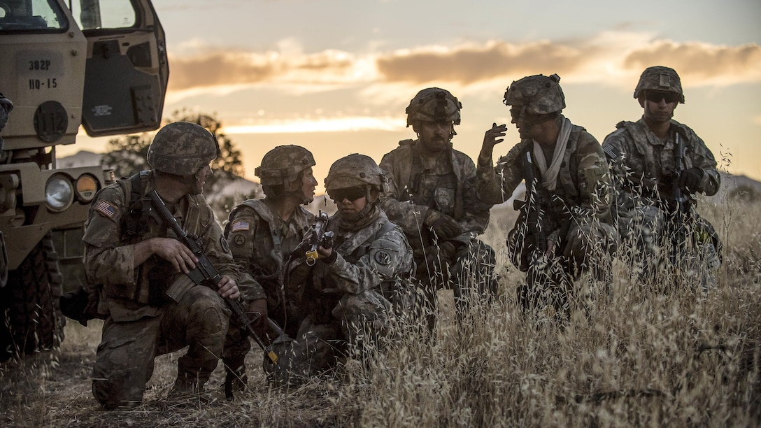 Soldiers conduct reconnaissance the night before a morning mission at Fort Hunter Liggett, Calif., July 22, 2017, as part of a combat support training exercise. The soldiers are military police reservists. Army Reserve photo by Master Sgt. Michel Sauret