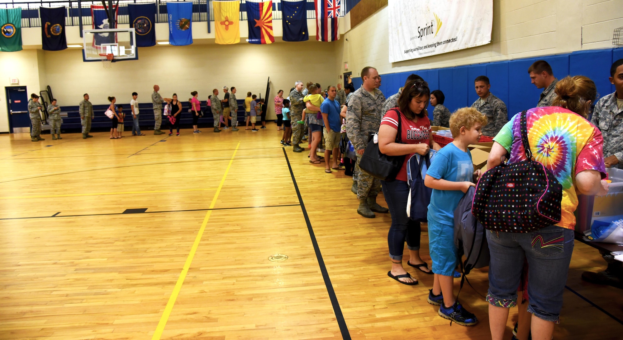 Team Moody lines up to collect school supplies at the Back to School Brigade, July 26, 2017, at Moody Air Force Base, Ga. The Airman and Family Readiness Center is scheduled to host another Back to School Brigade, August 16. (U.S. Air Force photo by Airman Eugene Oliver)