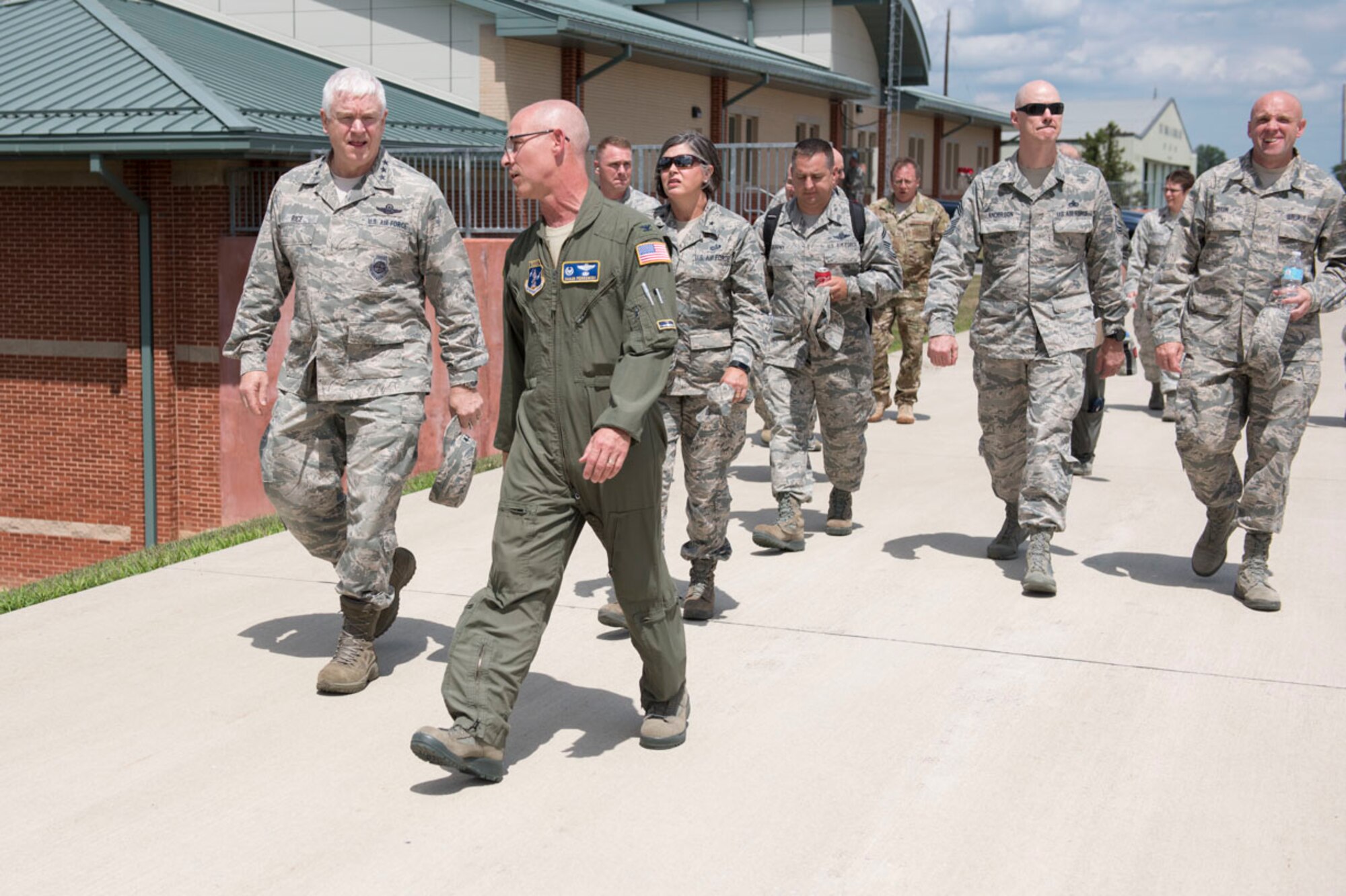 Lt. Gen. L. Scott Rice, Director of the Air National Guard is escorted by Col. Shaun Perkowski, 167th Airlift Wing commander, during a tour of the base, July 26. Rice and Chief Master Sgt. Ronald Anderson, ANG Command Chief, met with Airmen from each group at the Martinsburg, W.Va. air base. West Virginia National Guard Adjutant General, Maj. Gen. James A. Hoyer, Assistant Adjutant General for Air, Brig. Gen. Paige Hunter and State Command Chief, Chief Master Sgt. James Dixon joined the ANG leadership on the tour. Before visiting the 167AW, Rice and Anderson visited the National Boy Scouts Jamboree in Glen Jean, W.Va., and the 130th Airlift Wing in Charleston, W.Va. (U.S. Air National Guard photo by Senior Master Sgt. Emily Beightol-Deyerle)