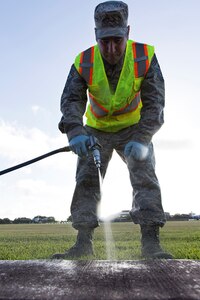 Chief Master Sgt. Kristopher K. Berg, 502nd Air Base Wing and Joint Base San Antonio command chief, sprays pesticides at JBSA-Lackland, Texas, July 20, 2017. Senior leadership from 502nd ABW and JBSA accompanied the 502nd Civil Engineer Squadron Pest Management pest control technicians as they completed work orders and took measures to keep the insect and animal population in check throughout the installation.
