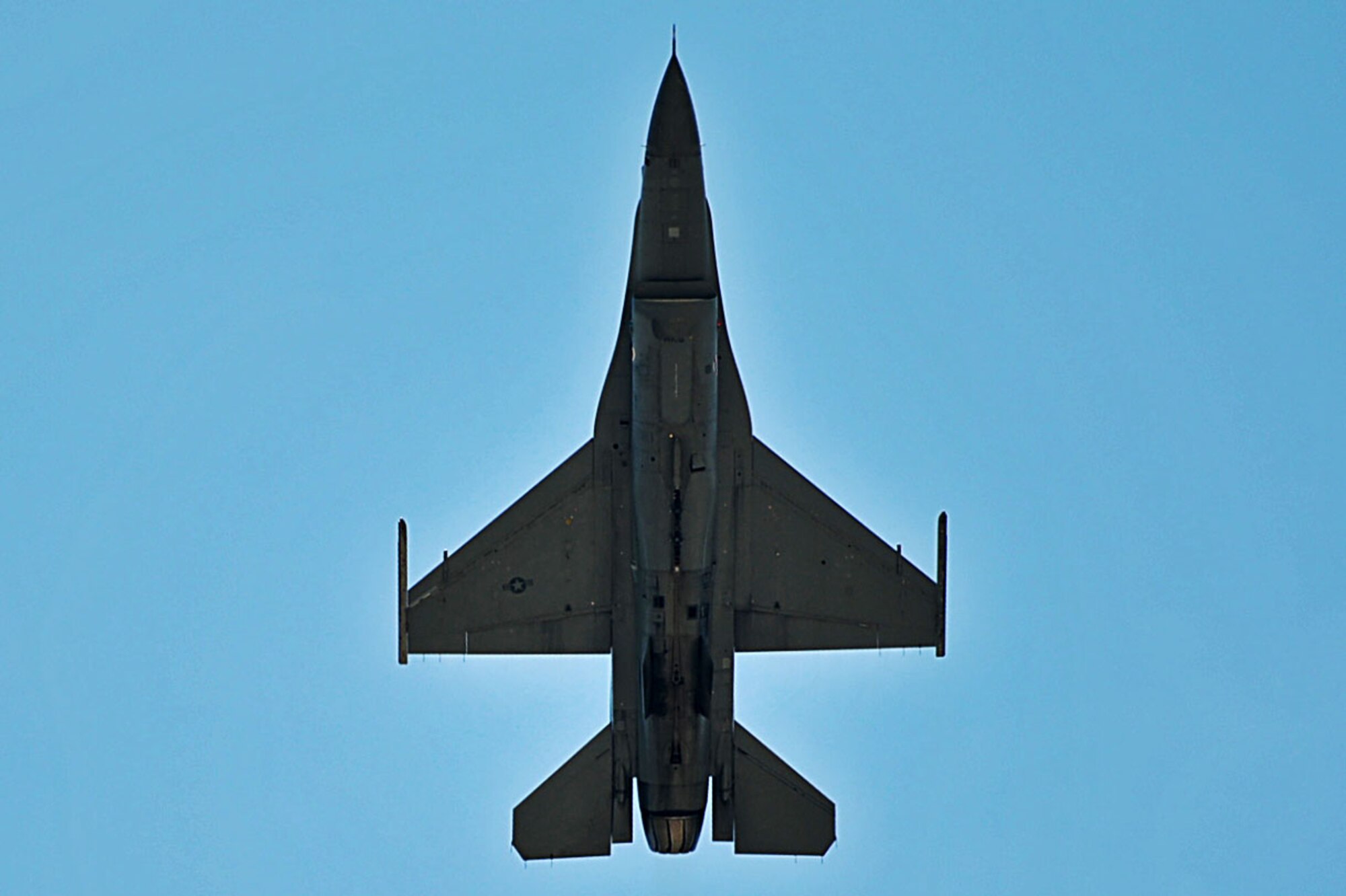 A U.S. Air Force F-16CM Fighting Falcon, piloted by Major John “Rain” Waters, Air Combat Command F-16 Viper Demonstration Team commander and pilot, performs an aerial practice at Shaw Air Force Base, S.C., July 28, 2017. The team performs precision aerial maneuvers to demonstrate the combat capabilities of one of the U.S. Air Force's premier multi-role fighters, the F-16 Fighting Falcon. (U.S. Air Force photo by Senior Airman Christopher Maldonado)
