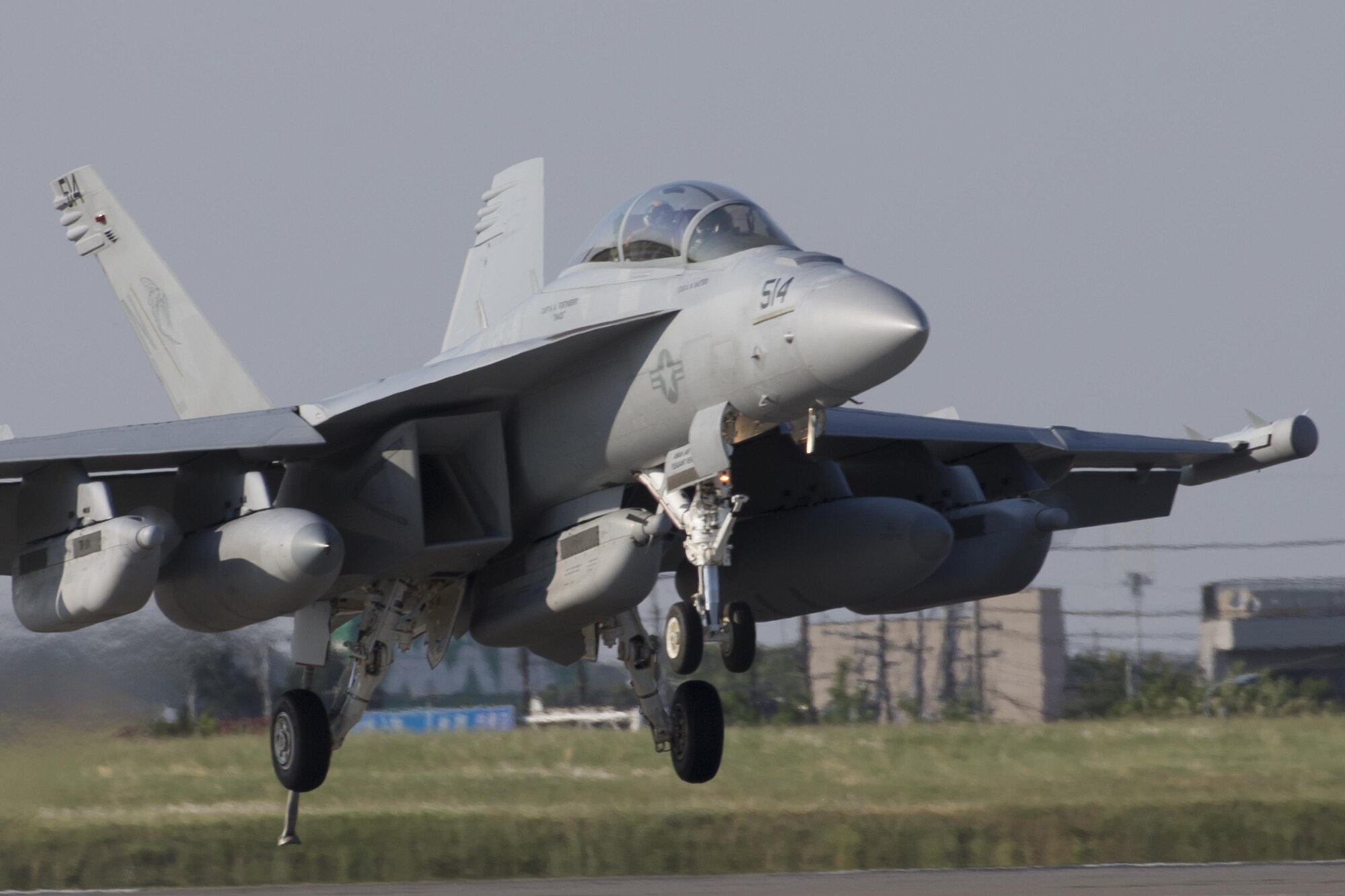 A Navy EA-18G Growler, assigned to the Electronic Attack Squadron (VAQ) 138, deploys a J-Hook to engage the aircraft arresting barrier system at Yokota Air Base, Japan, June 3, 2016. The 374th Civil Engineer Squadron power productions shop and fire department and 374th Operations Support Squadron airfield management flight are responsible for testing the system annually. (U.S. Air Force photo by Yasuo Osakabe/Released)