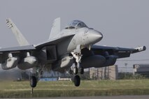 A Navy EA-18G Growler, assigned to the Electronic Attack Squadron (VAQ) 138, deploys a J-Hook to engage the aircraft arresting barrier system at Yokota Air Base, Japan, June 3, 2016. The 374th Civil Engineer Squadron power productions shop and fire department and 374th Operations Support Squadron airfield management flight are responsible for testing the system annually. (U.S. Air Force photo by Yasuo Osakabe/Released)