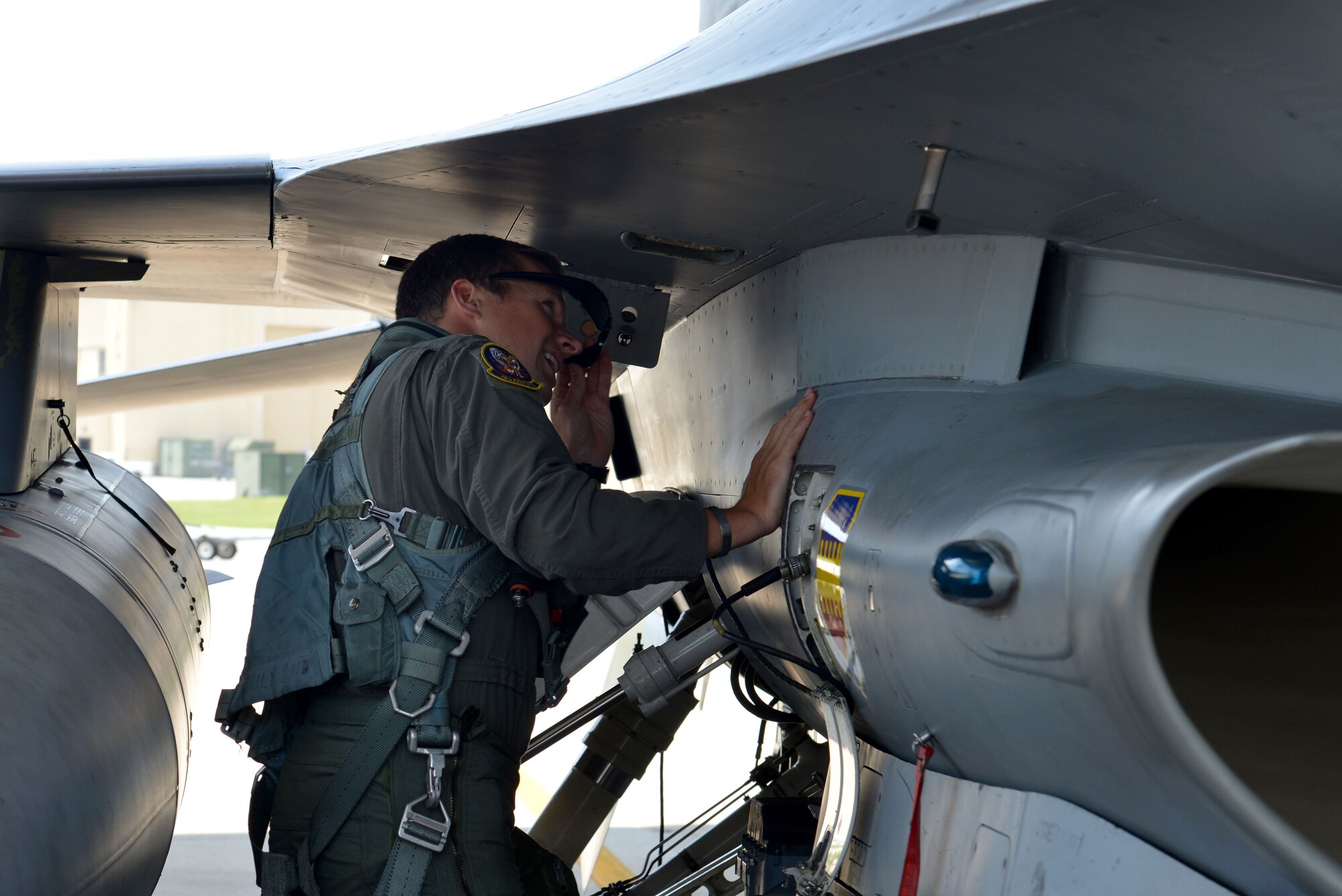 U.S. Air Force Capt. Matthew Kimmel, 79th Fighter Squadron (FS) pilot and U.S. Thunderbirds pilot-select, inspects an F-16CM Fighting Falcon prior to flying at Shaw Air Force Base, S.C., July 19, 2016. Kimmel was inspired by the Thunderbirds when he watched them perform at a Travis Air Force Base Air Show in California. (U.S. Air Force photo by Airman 1st Class Destinee Sweeney)