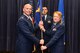 Col. Michael Manion, 55th Wing commander, presents the 55th Medical Group guidon to Col. Judy Stoltmann, incoming 55th MDG commander, at Offutt Air Force Base, Nebraska, July 28, 2017. The 55th MDG is the third medical group Stoltmann has commanded.