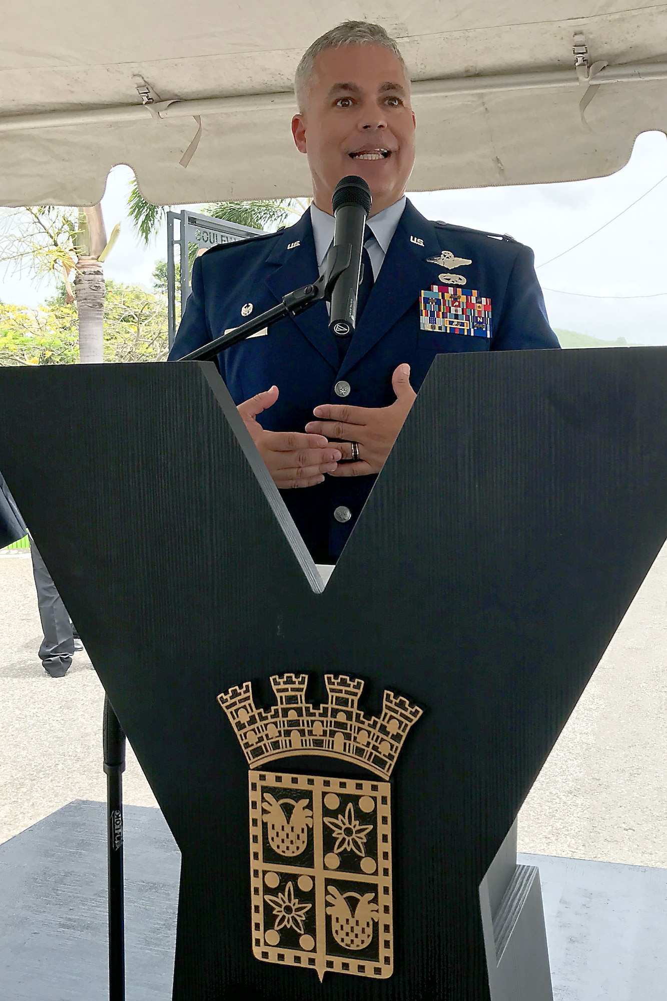 U.S. Col. Raymond Figueroa, 156th Airlift Wing commander, renders honor to Brig. Gen. Mihiel Gilormini during Brig. Gen. Mihiel Gilormini's posthumous street naming ceremony held in Yauco, Puerto Rico, July 15. (U.S. Air National Guard photo by Staff Sgt. Mizraim Gonzalez/Released)