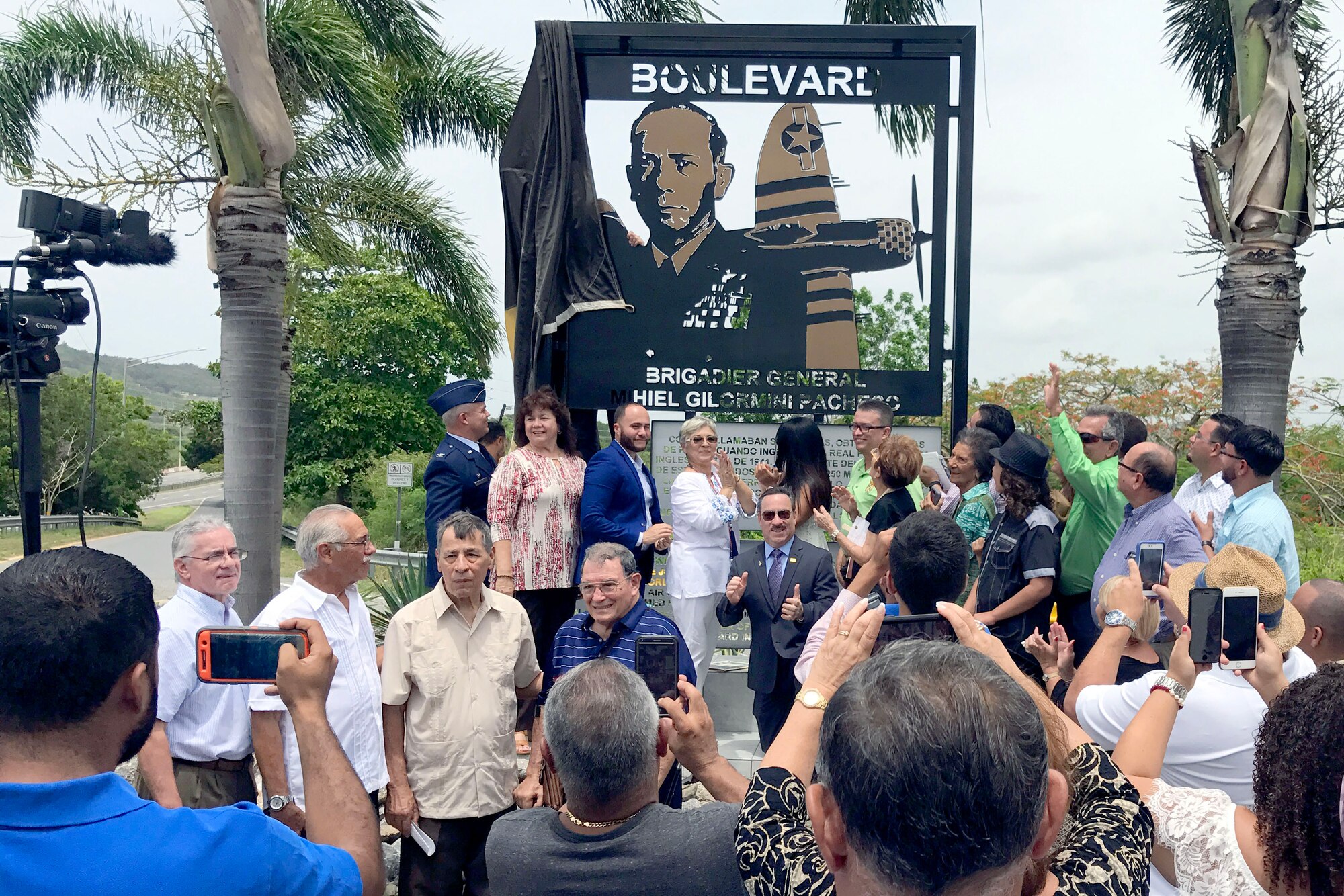 U.S. Air Force Brig. Gen. Mihiel Gilormini's distinguished visitor pose before his memorial during the posthumous street naming ceremony held in Yauco, Puerto Rico, July 15. (U.S. Air National Guard photo by Staff Sgt. Mizraim Gonzalez/Released)