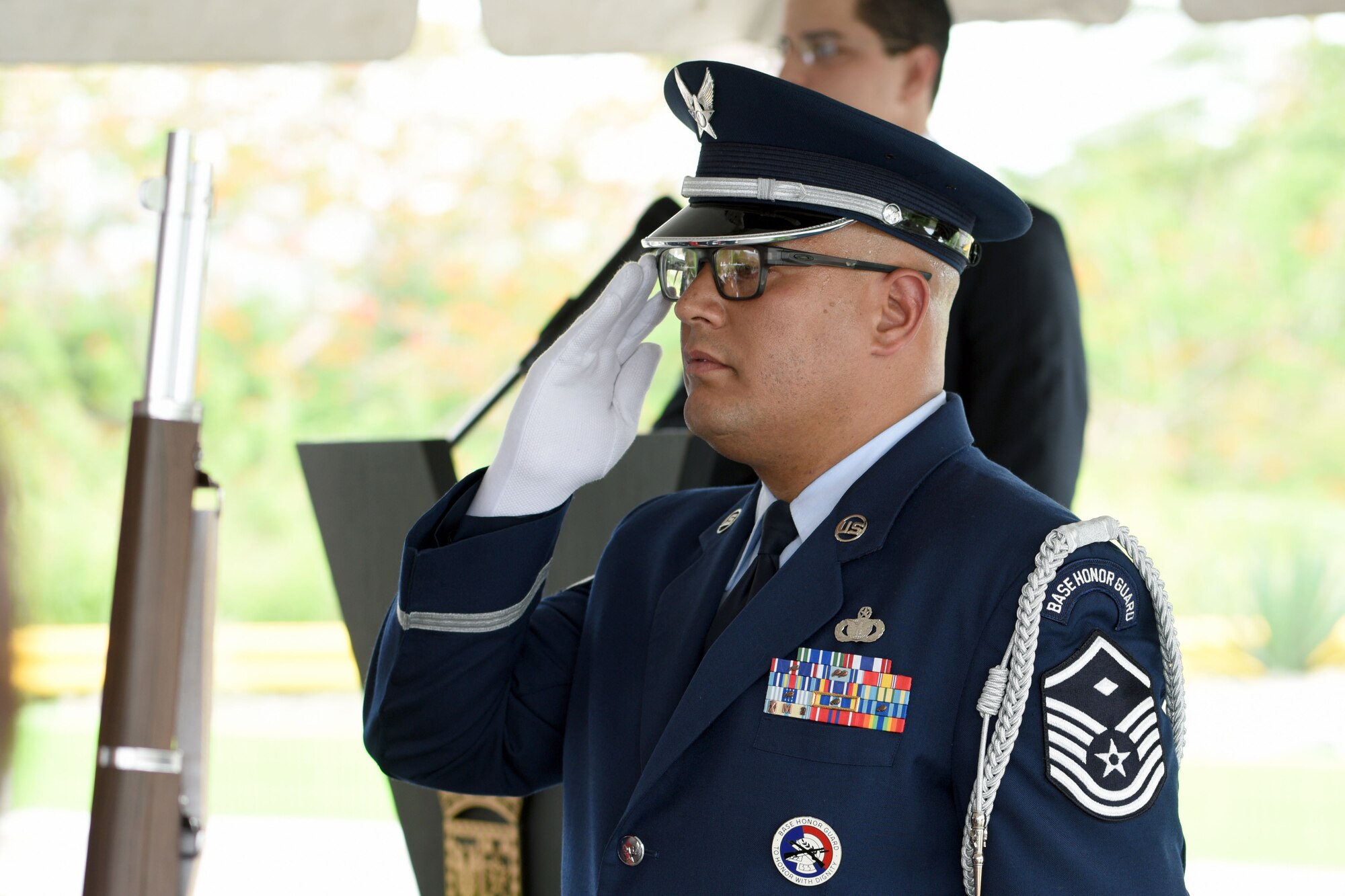 U.S. Airmen of the 156th Airlift Wing honor guard detail renders a salute during Brig. Gen. Mihiel Gilormini's posthumous street naming ceremony held in Yauco, Puerto Rico, July 15.