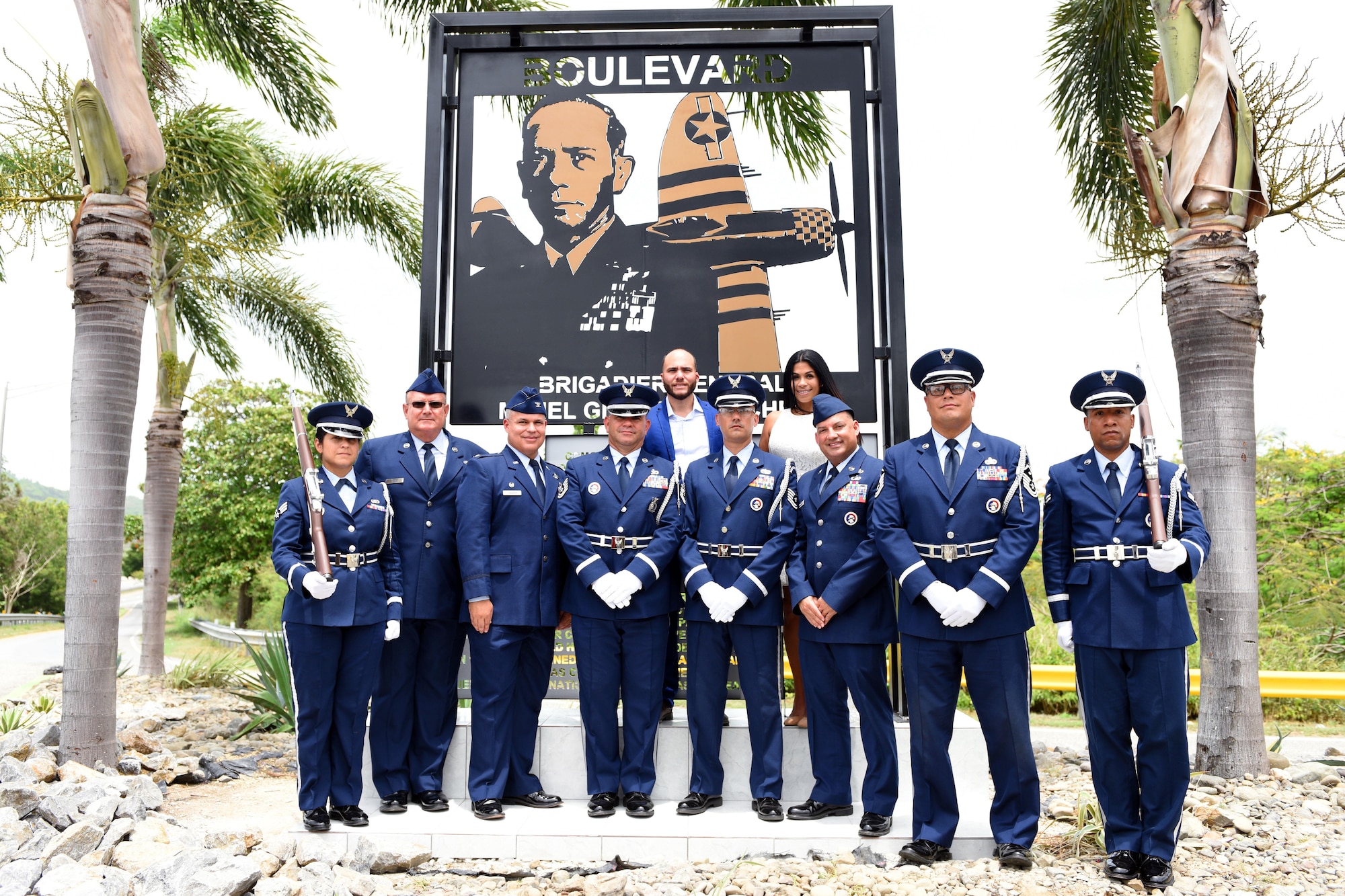 U.S. Airmen of the Puerto Rico Air National Guard pose before Brig. Gen. Mihiel Gilormini's memorial along with his children during Brig. Gen. Mihiel Gilormini's posthumous street naming ceremony held in Yauco, Puerto Rico, July 15. (U.S. Air National Guard photo by Staff Sgt. Mizraim Gonzalez/Released)