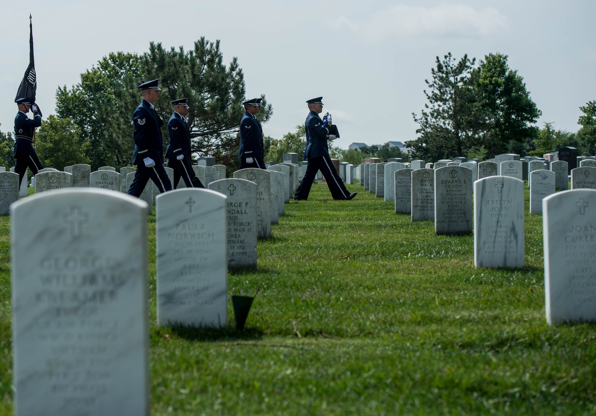 Service members render full honors for retired Col. Freeman Bruce Olmstead’s funeral at Arlington National Cemetery, Arlington, Va. July 27, 2017. Olmstead, an Air Force veteran and prisoner of war survivor, passed away Oct. 14, 2017.  (US Air Force Photo/Andy Morataya)