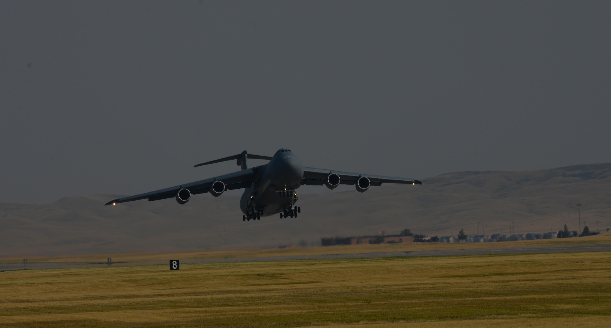 A C-5M Super Galaxy assigned to the 22nd Airlift Squadron, Travis Air Force Base, Calif., takes off from Ellsworth Air Force Base, S.D., July 22, 2017. The C-5 transported equipment and personnel in support of the Continuous Bomber Presence missions in the Pacific theater. (U.S. Air Force photo by Airman Nicolas Z. Erwin)