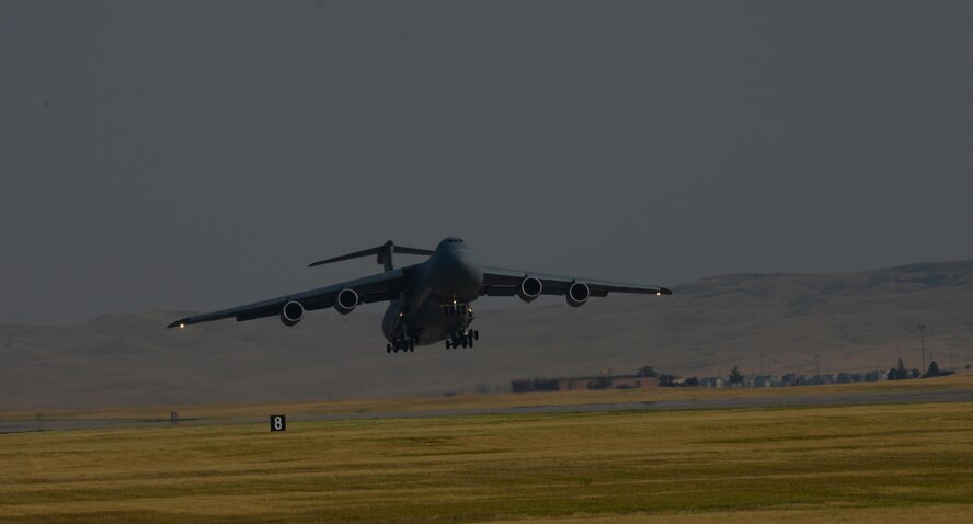 A C-5M Super Galaxy assigned to the 22nd Airlift Squadron, Travis Air Force Base, Calif., takes off from Ellsworth Air Force Base, S.D., July 22, 2017. The C-5 transported equipment and personnel in support of the Continuous Bomber Presence missions in the Pacific theater. (U.S. Air Force photo by Airman Nicolas Z. Erwin)