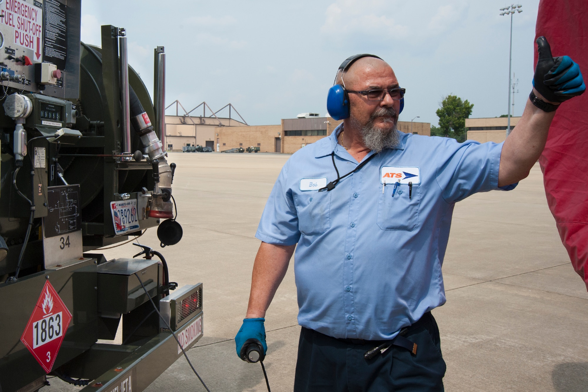 Bob Taylor, Akima Technical Solutions fuel distribution systems operator, gives the thumbs up to start refueling a 459th Air Refueling Wing KC-135R Stratotanker on the Joint Base Andrews, Maryland, flight line July 20, 2017. The KC-135 is refueled using a truck equipped with a hydraulic system to draw fuel from an underground reservoir onto the aircraft. (U.S Air Force photo/Tech. Sgt. Kat Justen)
