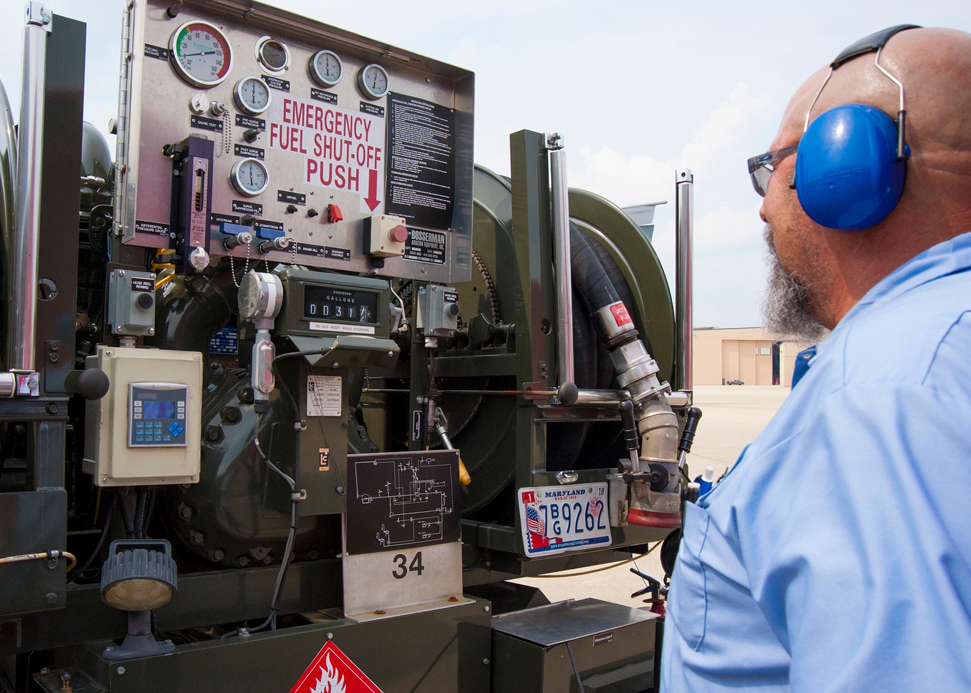 Bob Taylor, Akima Technical Solutions fuel distribution systems operator, monitors gauges on a fuel truck on the Joint Base Andrews, Maryland, flight line prior to refueling a 459th Air Refueling Wing KC-135R Stratotanker July 20, 2017. The KC-135 is refueled using a truck equipped with a hydraulic system to draw fuel from an underground reservoir onto the aircraft. (U.S Air Force photo/Tech. Sgt. Kat Justen)