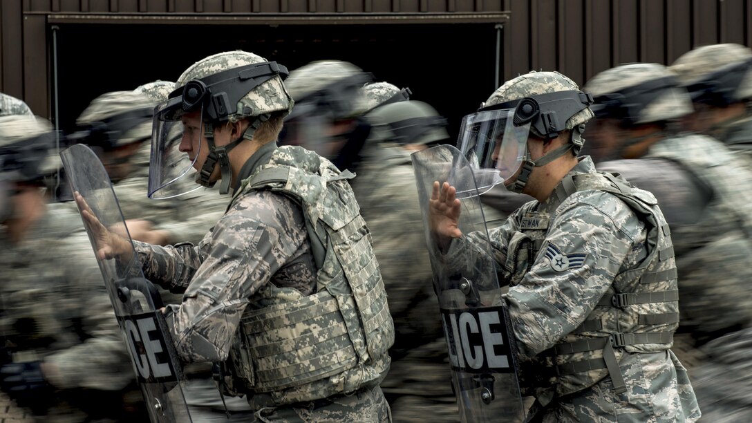 Airmen maneuver in formation during riot control training at Ramstein Air Base, Germany, July 25, 2017. The airmen are assigned to the 86th Security Forces Squadron. Air Force photo by Senior Airman Devin Boyer