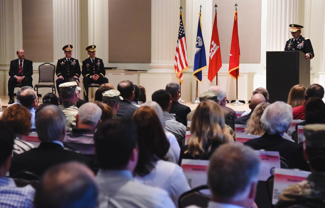 Col. Jose Aguilar, Portland District outgoing commander (right), addresses the audience during a change of command ceremony, July 28 at the Sentinel Hotel, Portland. “You are employees of character living the Army Values, you are competent in your profession, you are committed to selfless service and you are always taking steps to positively influence the culture of Portland District,” said Aguilar. 