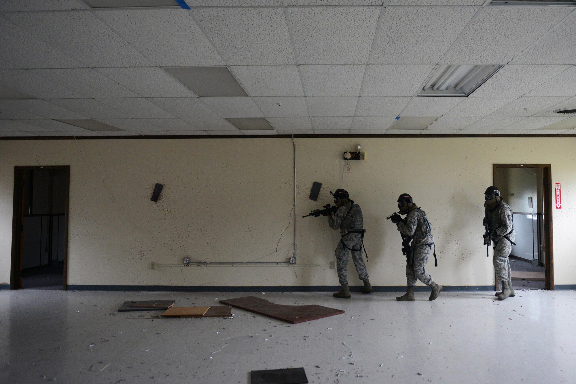 A team of 673d Security Forces Squadron members sweep a room during active-shooter training at Joint Base Elmendorf-Richardson, Alaska, July 18, 2017. Security forces trained in high-stress environments with hostages and aggressive perpetrators, so they learned how to appropriately respond and handle various hostile situations. 