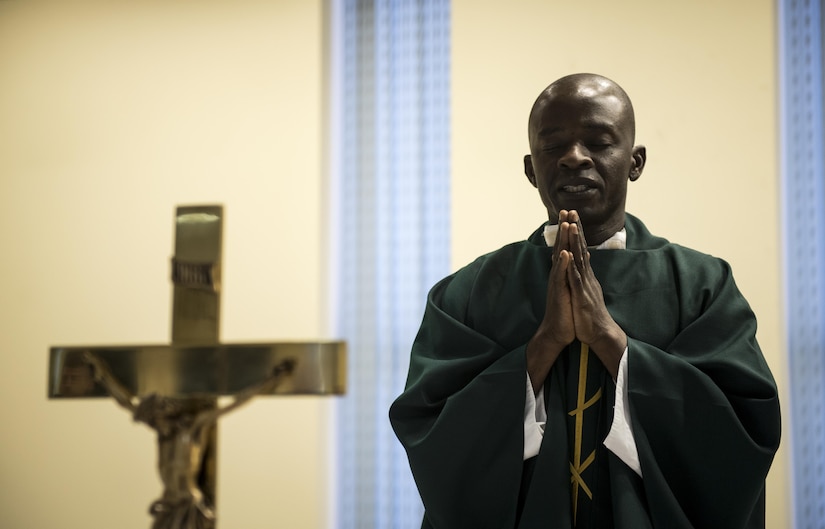 Chaplain (Capt.) John Appiah, 455th Air Expeditionary Wing, leads a prayer during a religious service at Hamid Karzai International Airport, Kabul, Afghanistan, July 23, 2017. Religious support teams from the 455th AEW provide spiritual support in seven locations in Afghanistan. (U.S. Air Force photo by Staff Sgt. Benjamin Gonsier) 