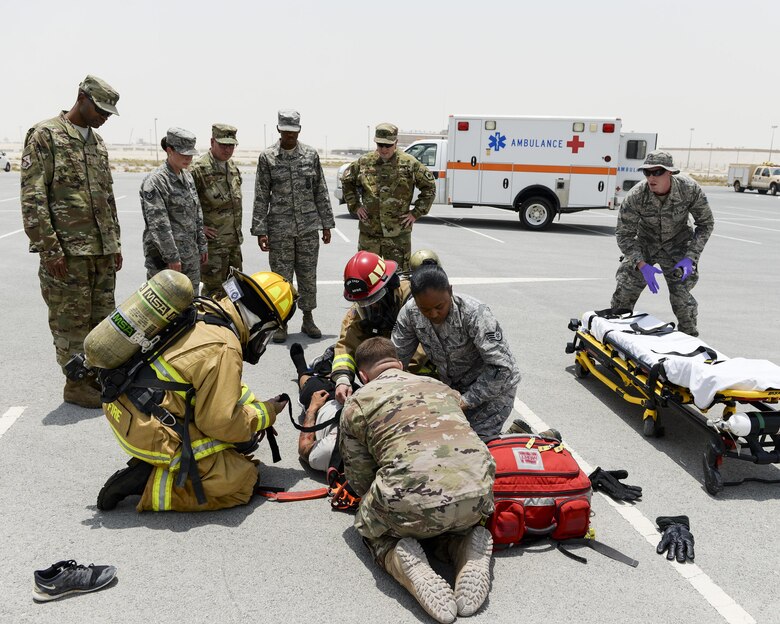 Leadership from the 379th Air Expeditionary Wing and the 379th Expeditionary Medical Squadron observe the response of firefighters and medical staff during an exercise at Al Udeid Air Base, Qatar, July 26, 2017. The exercise was designed to test and demonstrate emergency response capabilities available at Al Udeid Air Base. (U.S. Air National Guard photo by Tech. Sgt. Bradly A. Schneider/Released)