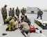 Leadership from the 379th Air Expeditionary Wing and the 379th Expeditionary Medical Squadron observe the response of firefighters and medical staff during an exercise at Al Udeid Air Base, Qatar, July 26, 2017. The exercise was designed to test and demonstrate emergency response capabilities available at Al Udeid Air Base. (U.S. Air National Guard photo by Tech. Sgt. Bradly A. Schneider/Released)
