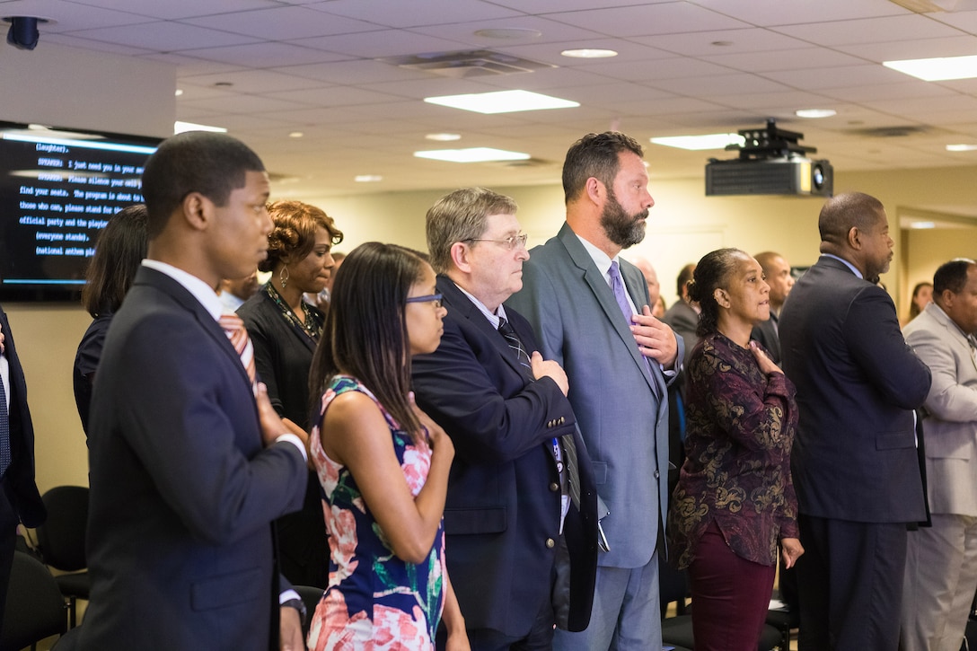 Federal employees and interns who earned the 2017 Workforce Recruitment Program Judith C. Gilliom awards stand for the National Anthem during the annual award and networking event at the U.S. Access Board in Washington, D.C., July 27, 2017. The U.S. Department of Labor’s Office of Disability Employment Policy co-hosted the event. Department of Labor photo by Alyson Fligg