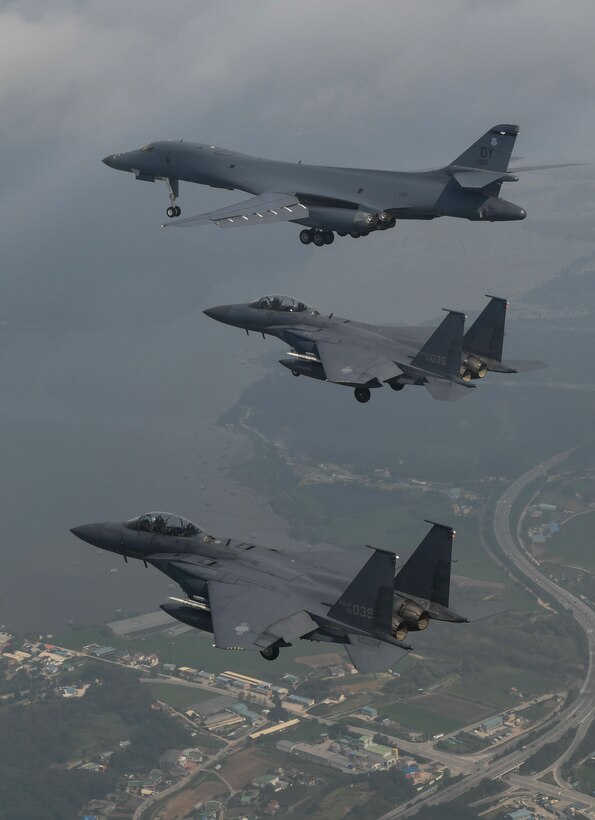 In a demonstration of ironclad U.S. commitment to our allies, a U.S. Air Force B-1B Lancer assigned to the 9th Expeditionary Bomb Squadron, deployed from Dyess Air Force Base, Texas, is joined by Republic of Korea air force F-15s during a 10-hour mission from Andersen Air Force Base, Guam, into Japanese airspace and over the Korean Peninsula, July 30, 2017. The B-1s first made contact with Japan Air Self-Defense Force F-2 fighter jets in Japanese airspace, then proceeded over the Korean Peninsula and were joined by South Korean F-15 fighter jets. This mission is in direct response to North Korea’s escalatory launch of intercontinental ballistic missiles on July 3 and 28. (Courtesy photo)