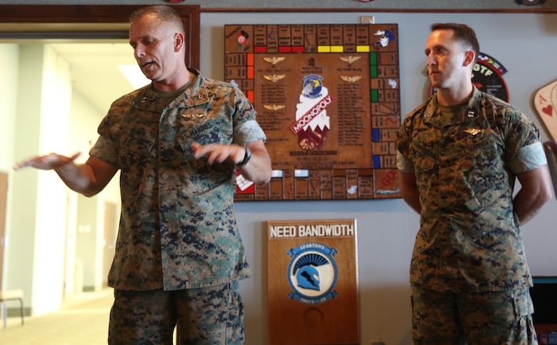 Maj. Gen. Matthew Glavy, talks to a crowd about Capt. Peter Abramovs during an awards ceremony aboard Marine Corps Air Station Cherry Point, N.C., July 28, 2017. Abramovs was awarded the Air Medal for heroism while training at Marine Corps Training Area Bellows, O’ahu, Hawai’i, on May 17, 2015. While conducting MV-22 Osprey training exercises, an aircraft conducted a hard landing at the training area, May 17, 2015. Although wounded during the hard landing, Abramovs returned to the downed aircraft multiple times in order to evacuate and aid his fellow Marines. Glavy is the commanding general of 2nd Marine Aircraft Wing, and Abramovs is an AV-8B Harrier II pilot with Marine Attack Squadron 231, Marine Aircraft Group 14, 2nd MAW. (U.S. Marine Corps Photo by Pfc. Skyler Pumphret/ Released)