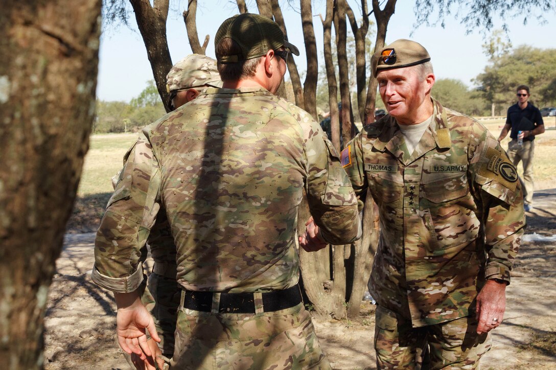 Army Gen. Raymond A. Thomas III, right, commander of U.S. Special Operations Command, meets members of the U.S. special operations team during Fuerzas Comando 2017 in Vista Alegre, Paraguay, July 24, 2017. The soldiers are Army Green Berets assigned to 7th Special Forces Group, from Eglin Air Force Base, Fla. Army photo by Staff Sgt. Osvaldo Equite