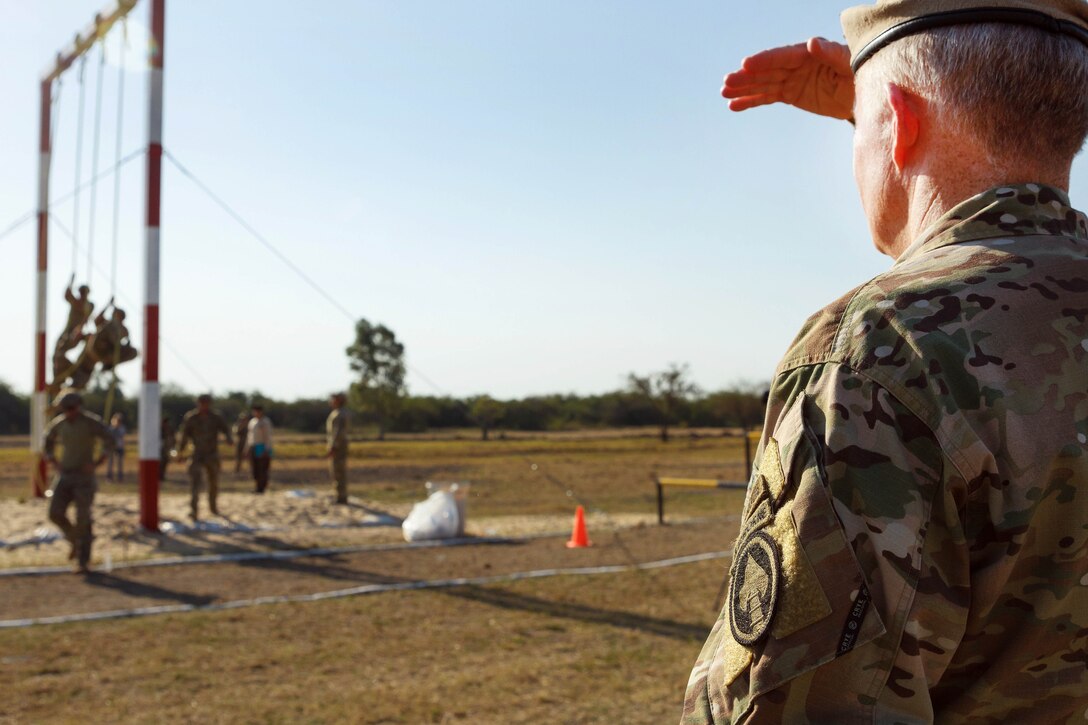 Army Gen. Raymond A. Thomas III, commander of U.S. Special Operations Command, watches members of the U.S. special operations team navigate an obstacle during Fuerzas Comando 2017 in Vista Alegre, Paraguay, July 24, 2017. Army photo by Staff Sgt. Osvaldo Equite