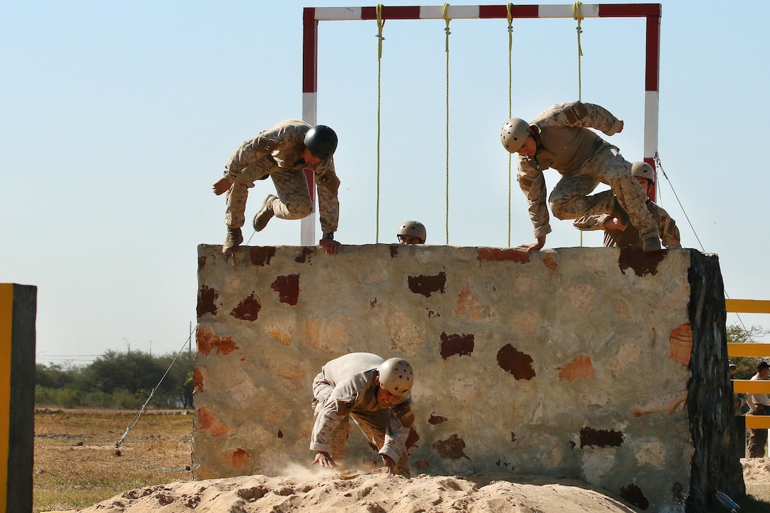 Members of the Chilean special operations team jump down from an obstacle during Fuerzas Comando 2017 in Vista Alegre, Paraguay, July 24, 2017. Army photo by Spc. Elizabeth Williams