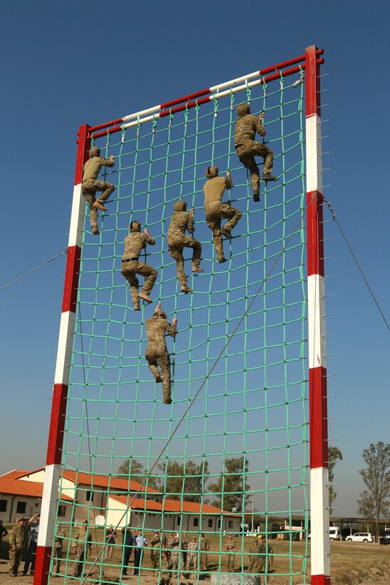 Members of the U.S. special operations team climb a cargo net during Fuerzas Comando 2017 in Vista Alegre, Paraguay, July 24, 2017. Army photo by Staff Sgt. Chad Menegay