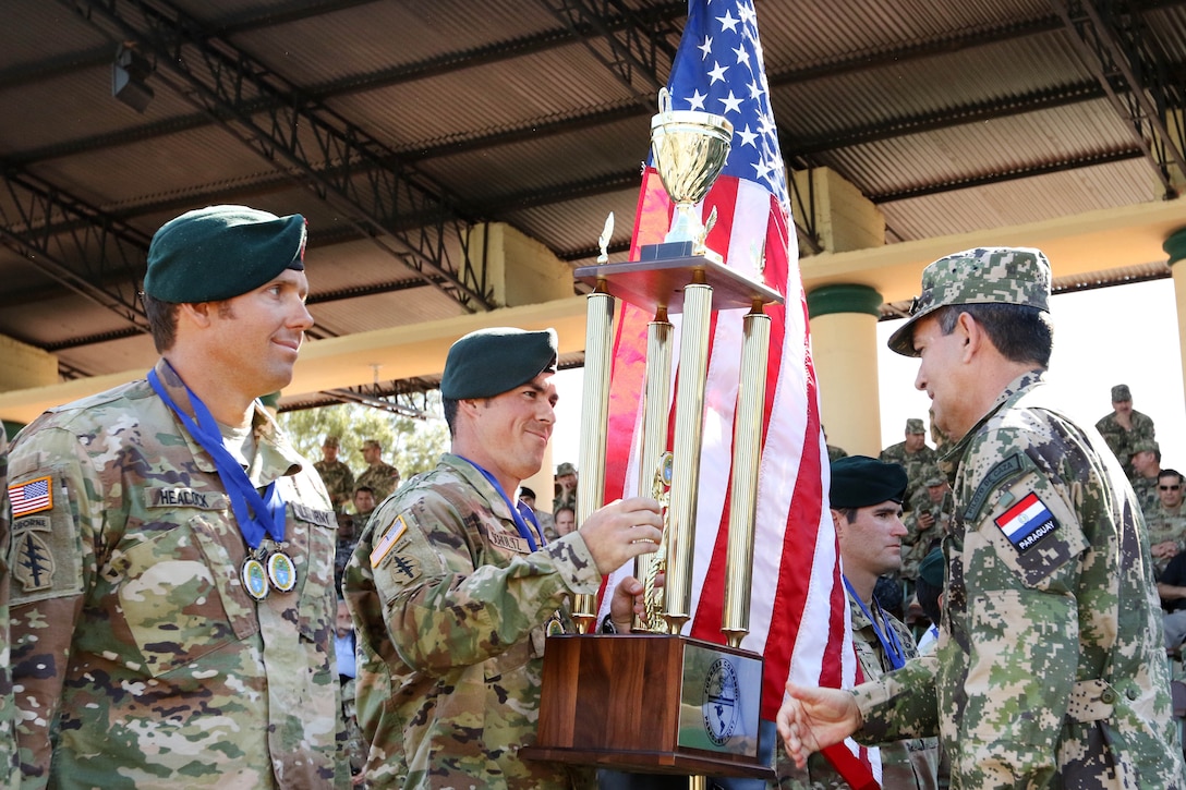 Members of the U.S. special operations team receive the third-place trophy for the Fuerzas Comando competition during the closing ceremony in Mariano Roque Alonso, Paraguay, July 27, 2017. Army photo by Sgt. Joanna Bradshaw