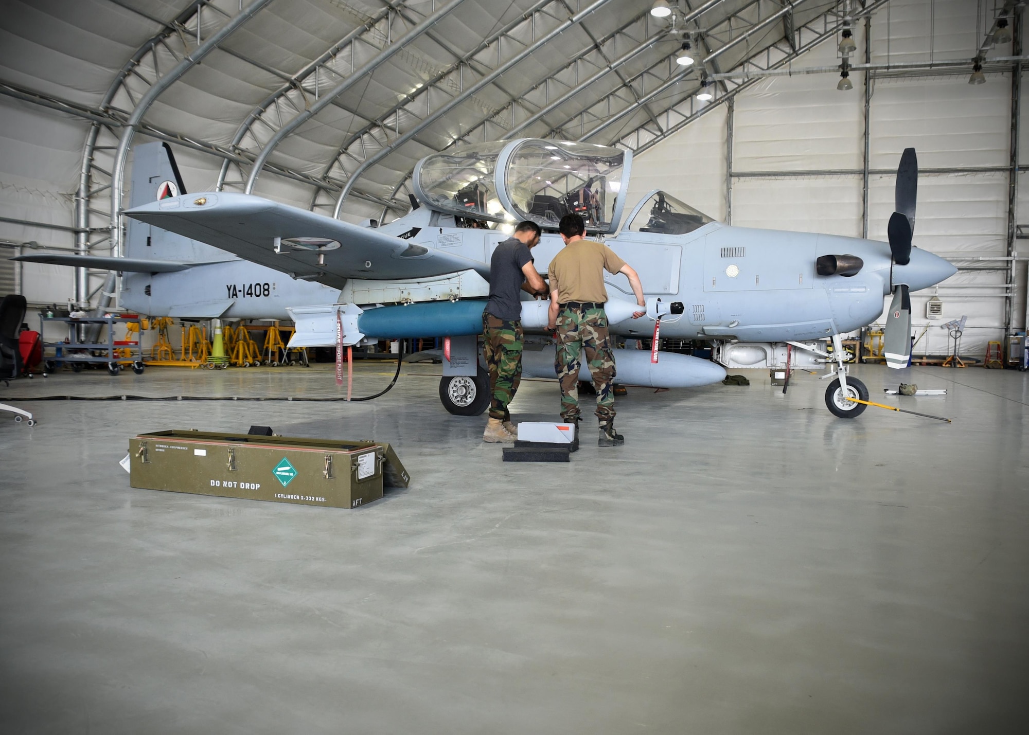 Two Afghan Air Force A-29 Super Tucano maintainers download GBU-12s (Guided Bomb Unit) at Kabul Air Wing, Afghanistan, July 26, 2017. Recently, AAF A-29 maintenance leadership requested to take full responsibility for flight line maintenance operations from Train, Advise, Assist Command-Air advisors and contract maintenance. This initiative by the maintainers is another step closer to the AAF becoming a professional, capable and sustainable force. (U.S. Air Force photo by Tech. Sgt. Veronica Pierce)